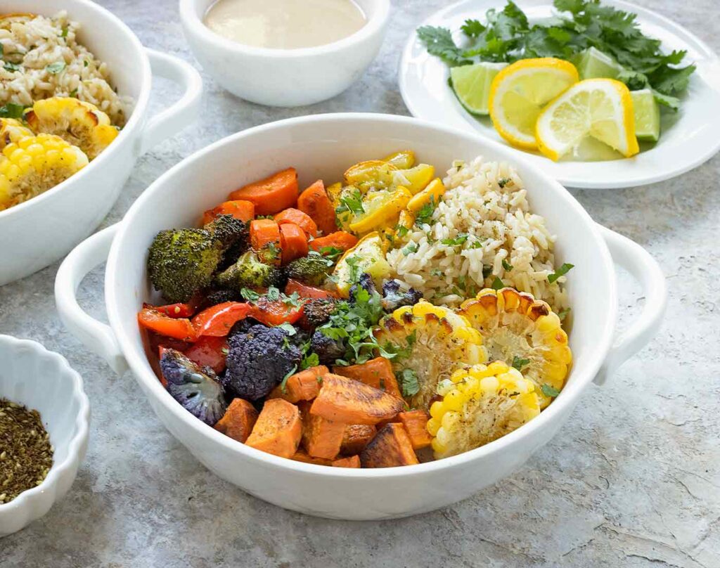 A bowl of Mediterranean Vegetable Sheet Pan dinner.