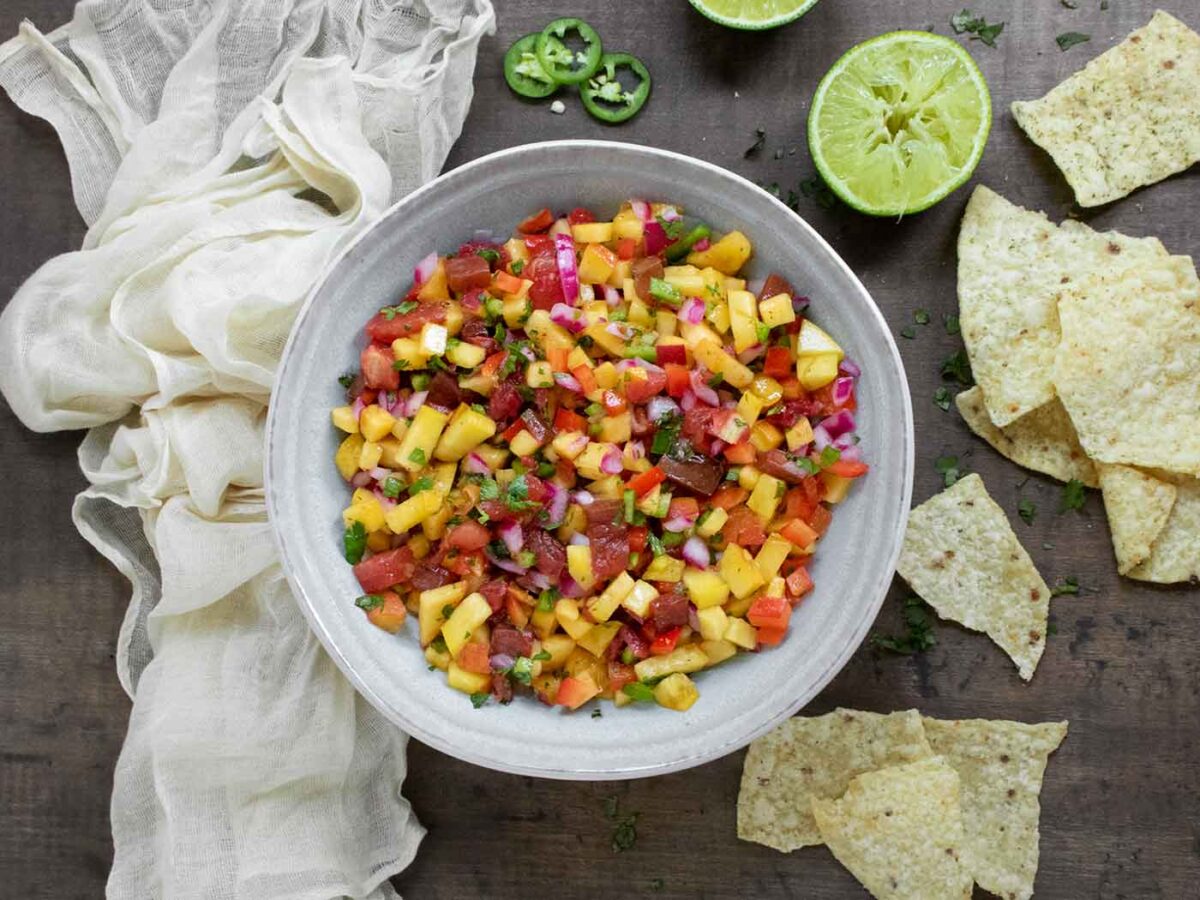Overhead view of Peach Salsa in a light gray bowl.