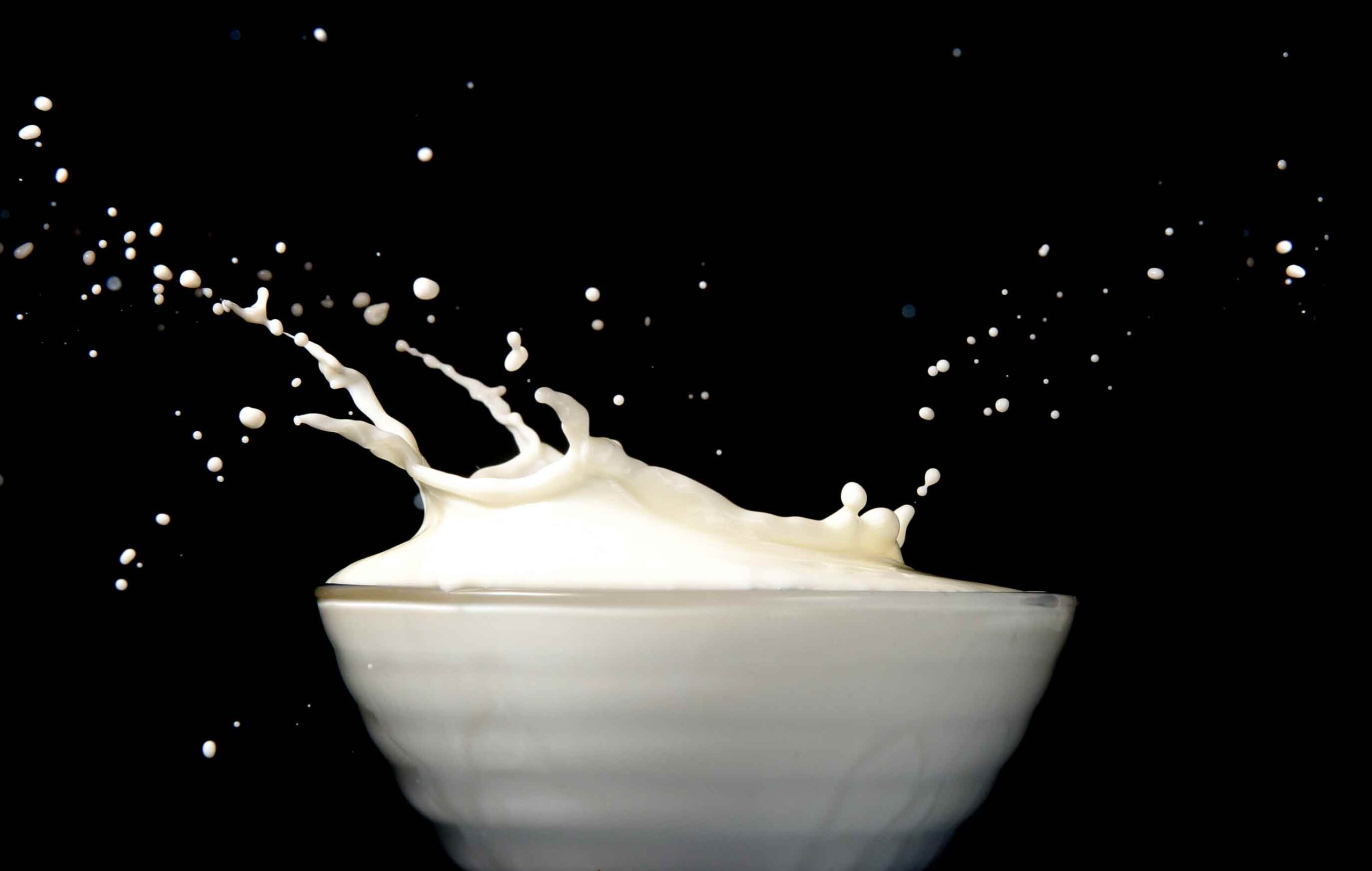 A bowl of milk splashing droplets.