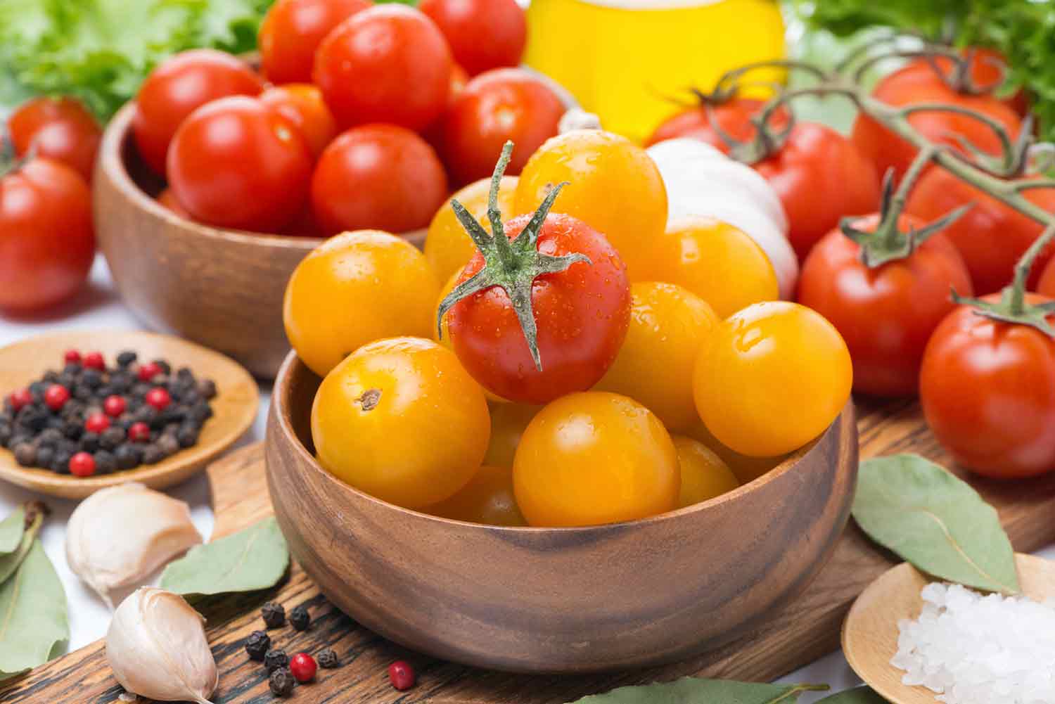 Cherry tomatoes in a wooden bowl.