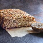 Side view of Magic Seed & Nut Loaf, with a slice removed.