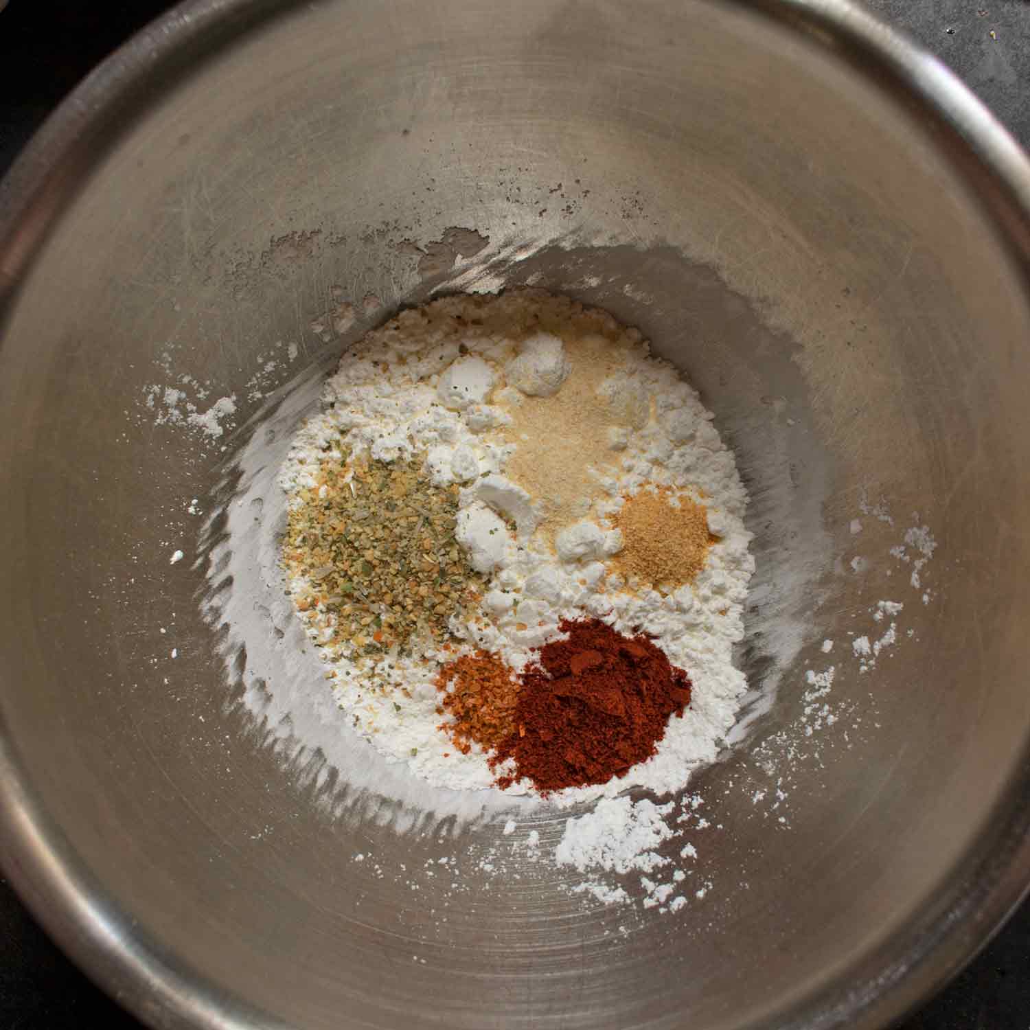 Cornstarch and seasonings in a bowl.