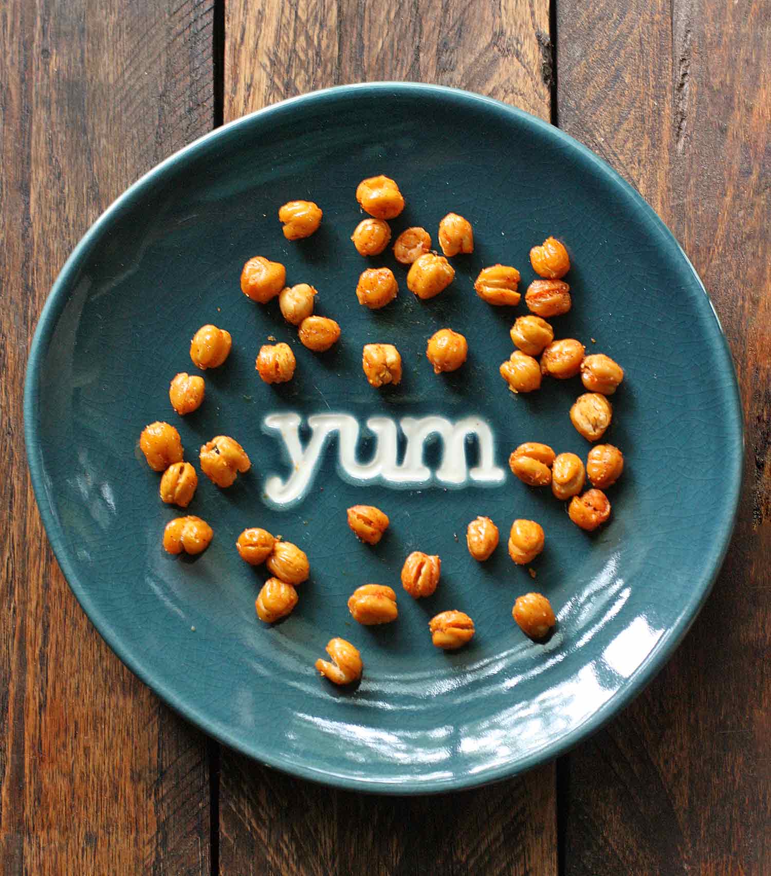 Oven Roasted Chickpeas on a blue plate that says Yum in the center.