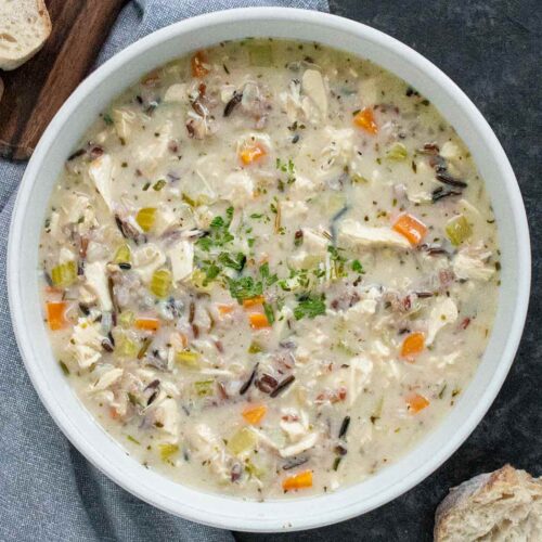 Leftover Turkey & Wild Rice Soup in a white bowl.
