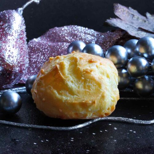 A puffy, cheesy gougere with Christmas decorations.