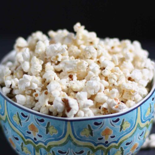 Parmageddon Popcorn in a blue bowl.