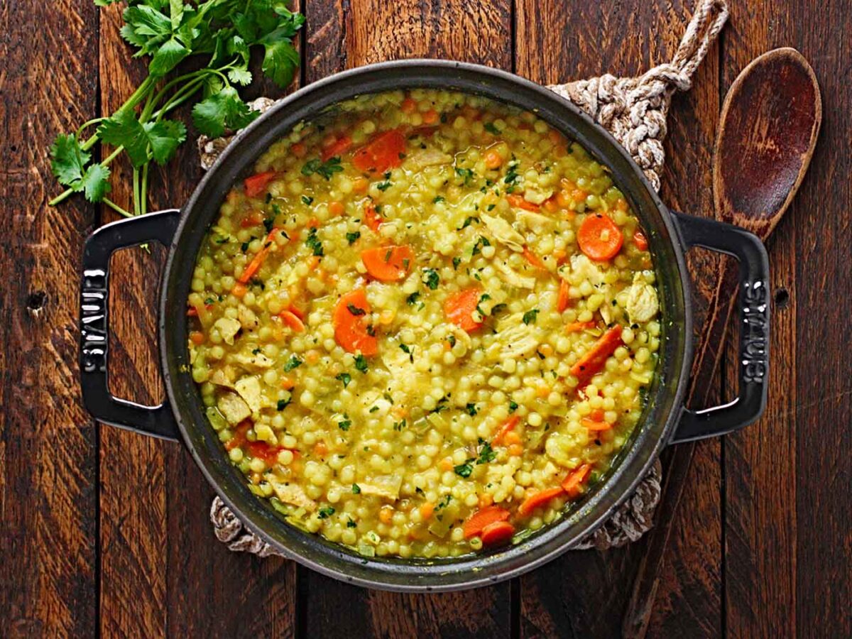 Overhead view of a pot of Cold-Fighting Couscous Chicken Soup.