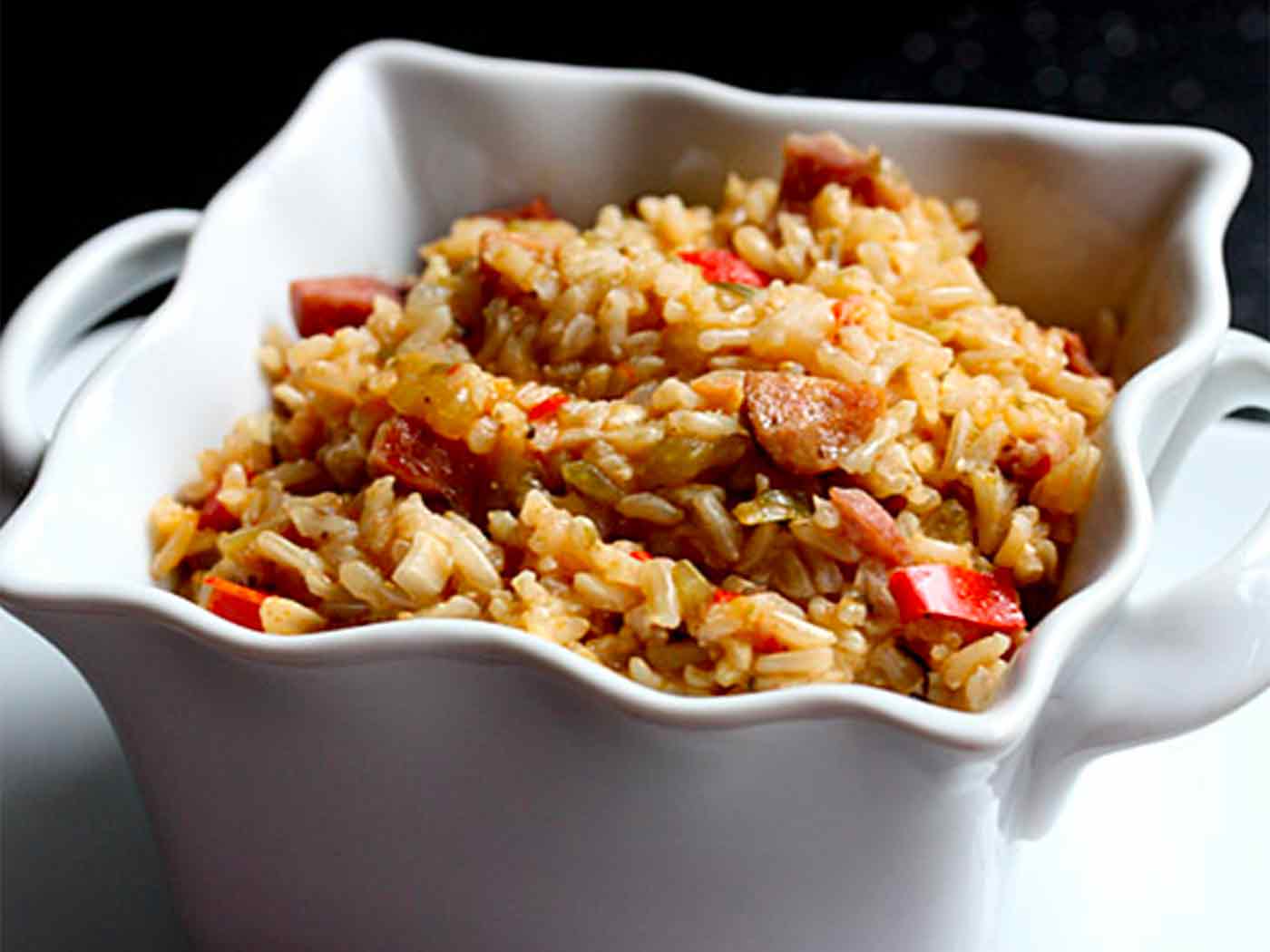 Fat Tuesday Jambalaya in a square, white bowl.