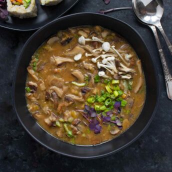 Wild Mushroom Miso Soup in a black bowl.