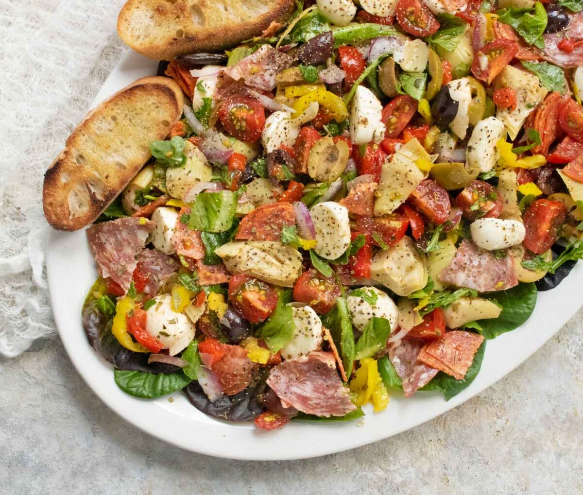 Italian Antipasto Salad on a white platter.