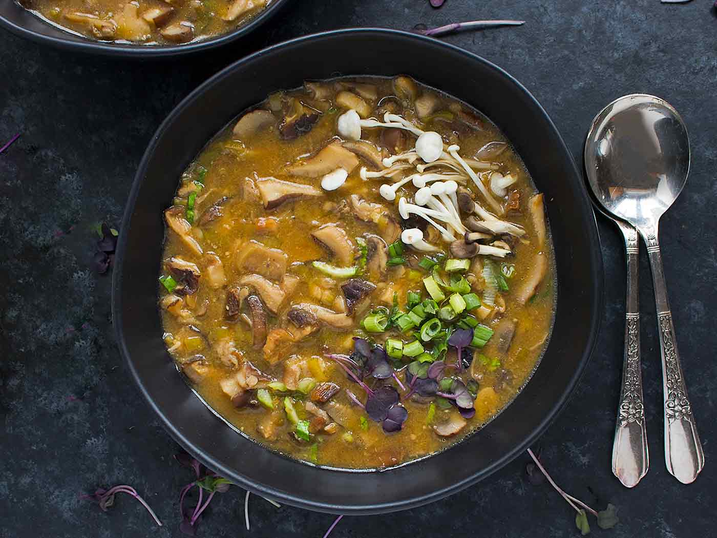 Wild Mushroom Miso Soup in a black bowl.