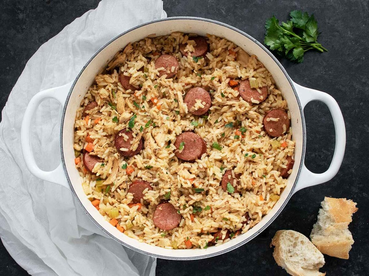 Chicken Bog in a large white Dutch oven.