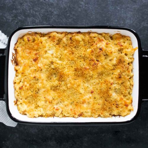 Overhead view of French Onion Mac and Cheese in a white baking pan with black edges.