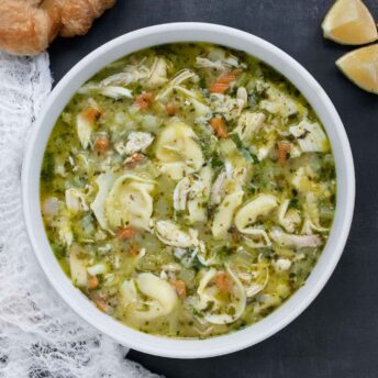 Overhead view of a bowl of Rotisserie Chicken Tortellini Soup.