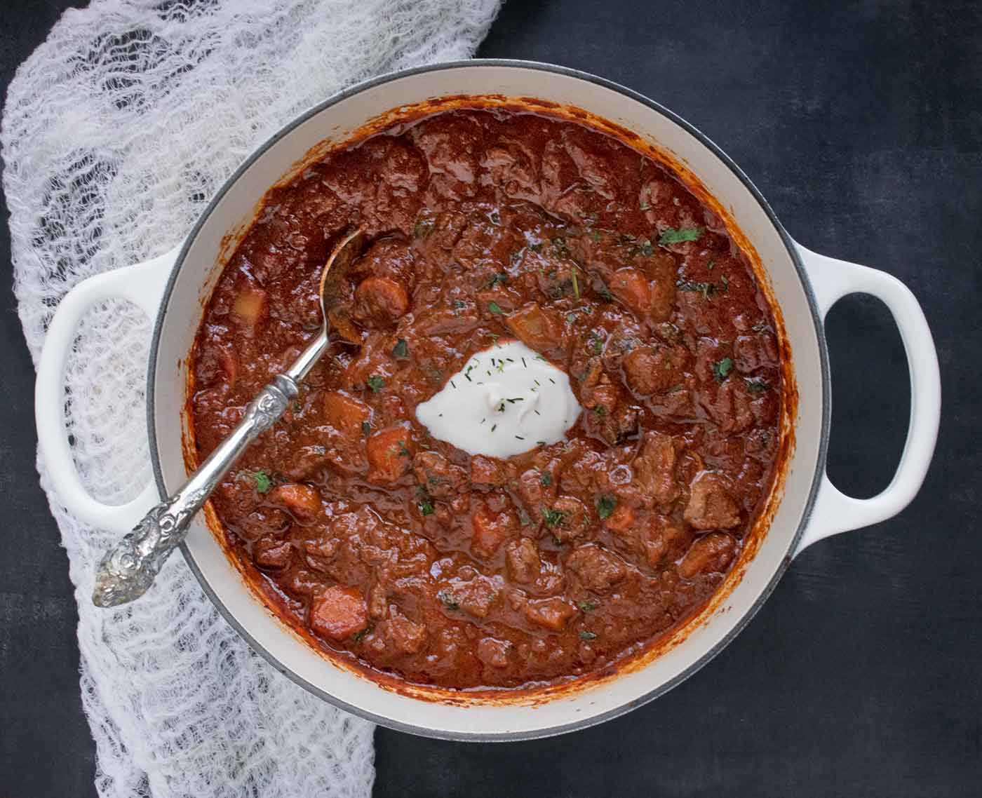 Austrian Hungarian Goulash in a large white Dutch oven.