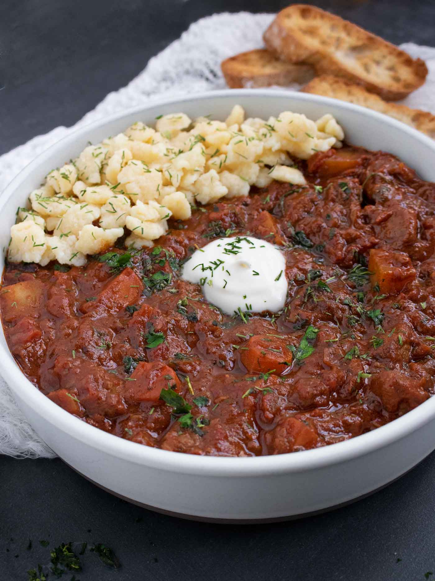 Side-angled view of a bowl of Austrian Hungarian Goulash.