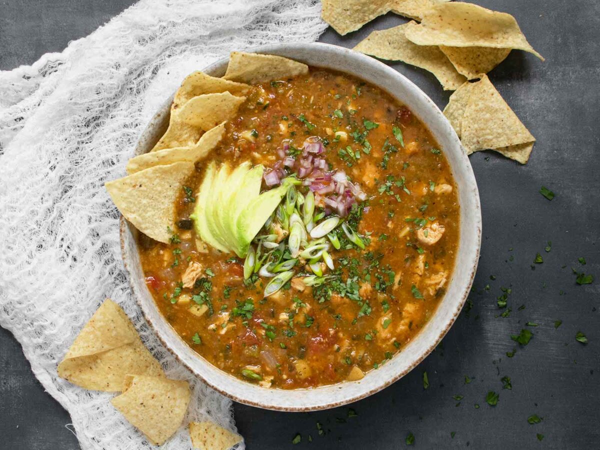 Overhead view of Chile Verde Tortilla Soup in a bowl.