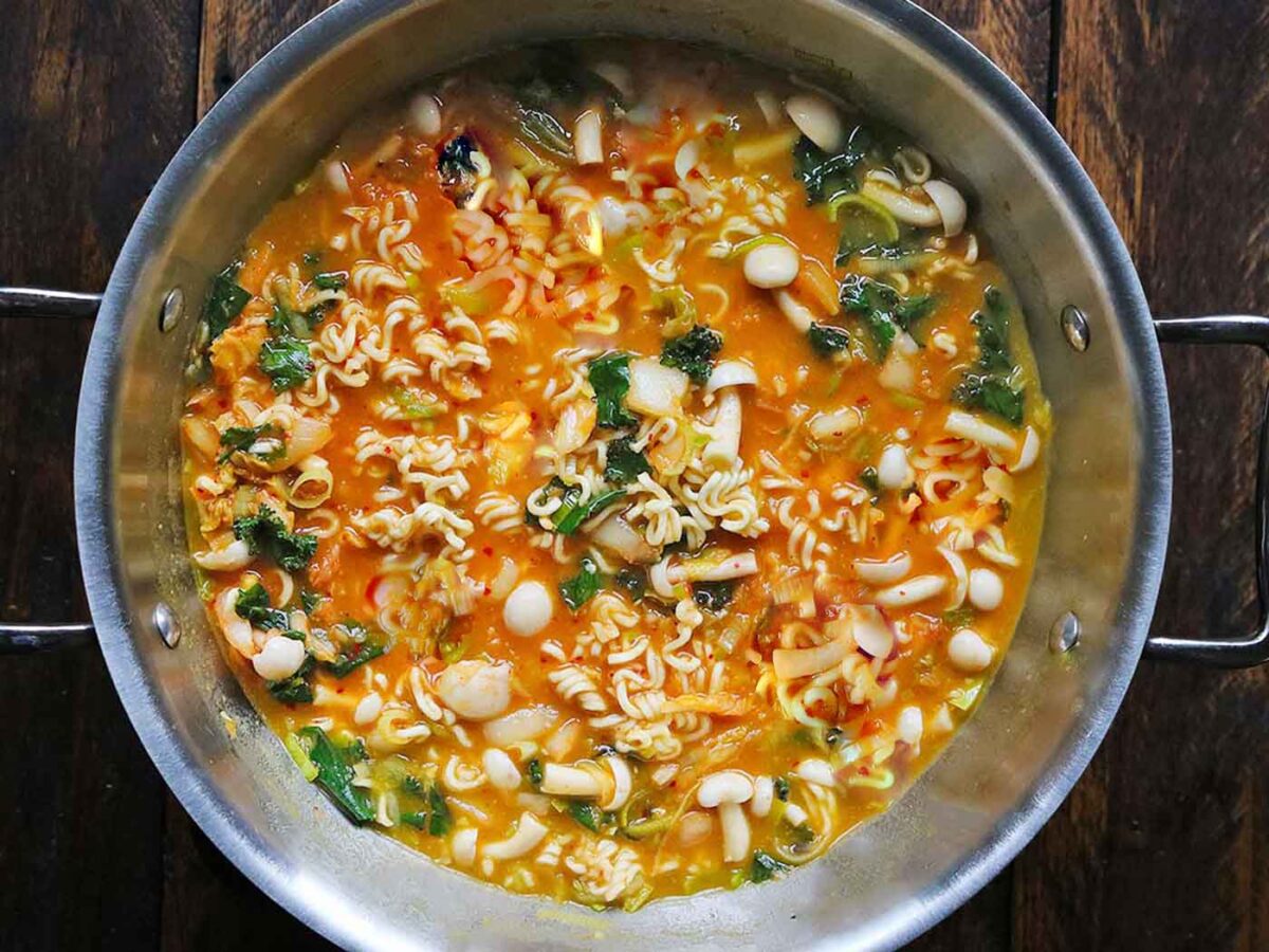 Overhead view of a pot of Kimchi Ramen Noodle Soup.