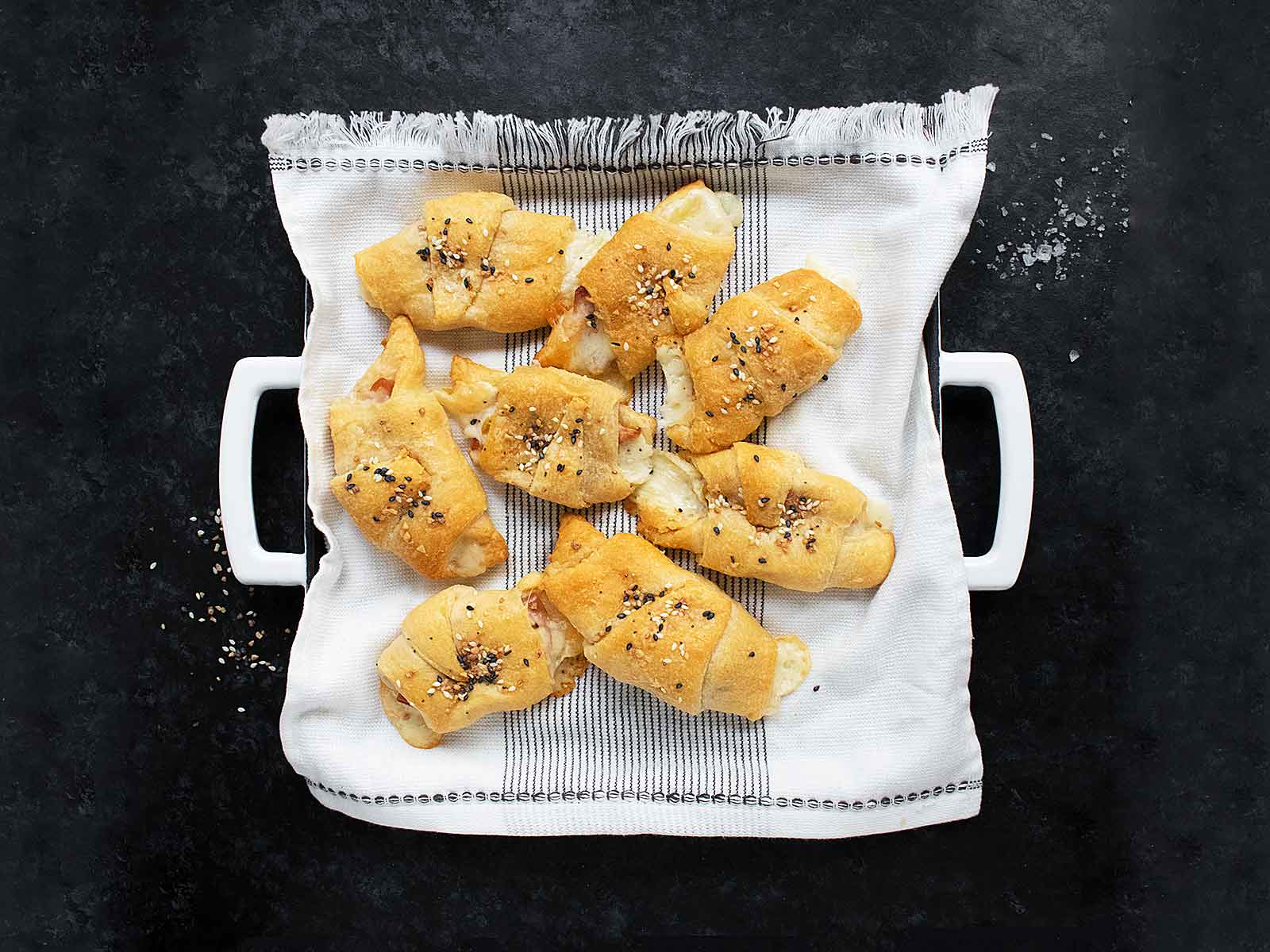 Overhead view of Mortadella Stuffed Crescent Rolls on a serving tray.