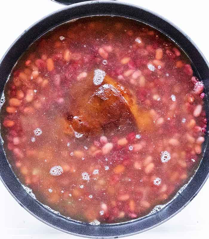 Beans covered by their cooking water.