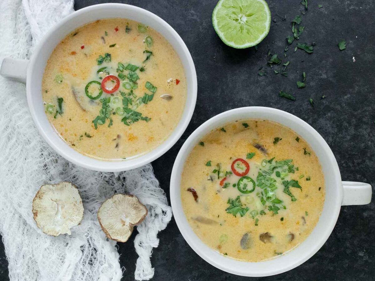 Overhead view of two bowls of Thai Coconut Mushroom Soup.