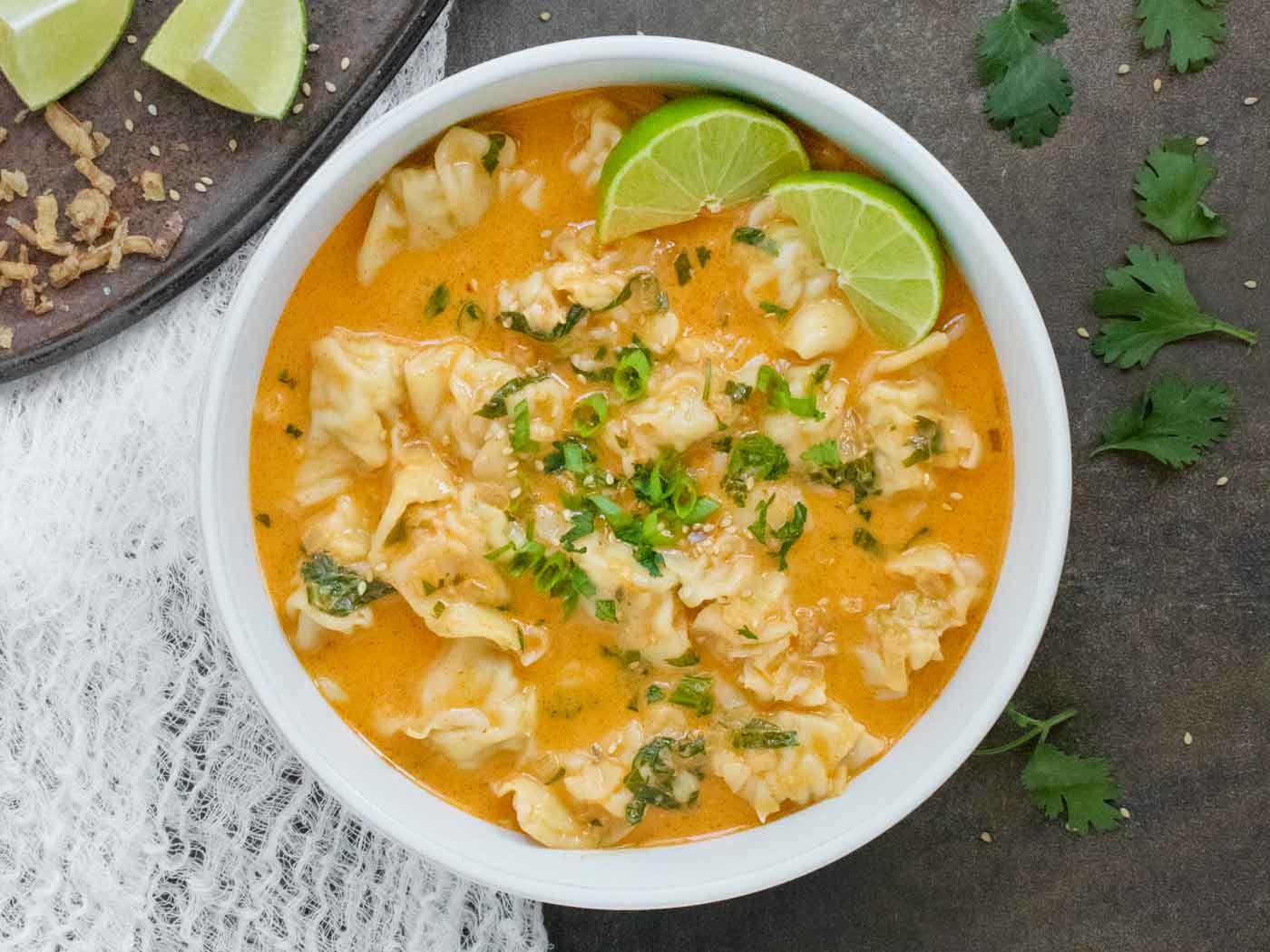 Thai Red Curry Dumpling Soup in a white bowl.