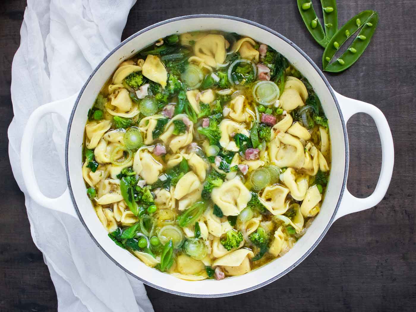 Photo from above of a pot of Tortellini Primavera Soup.