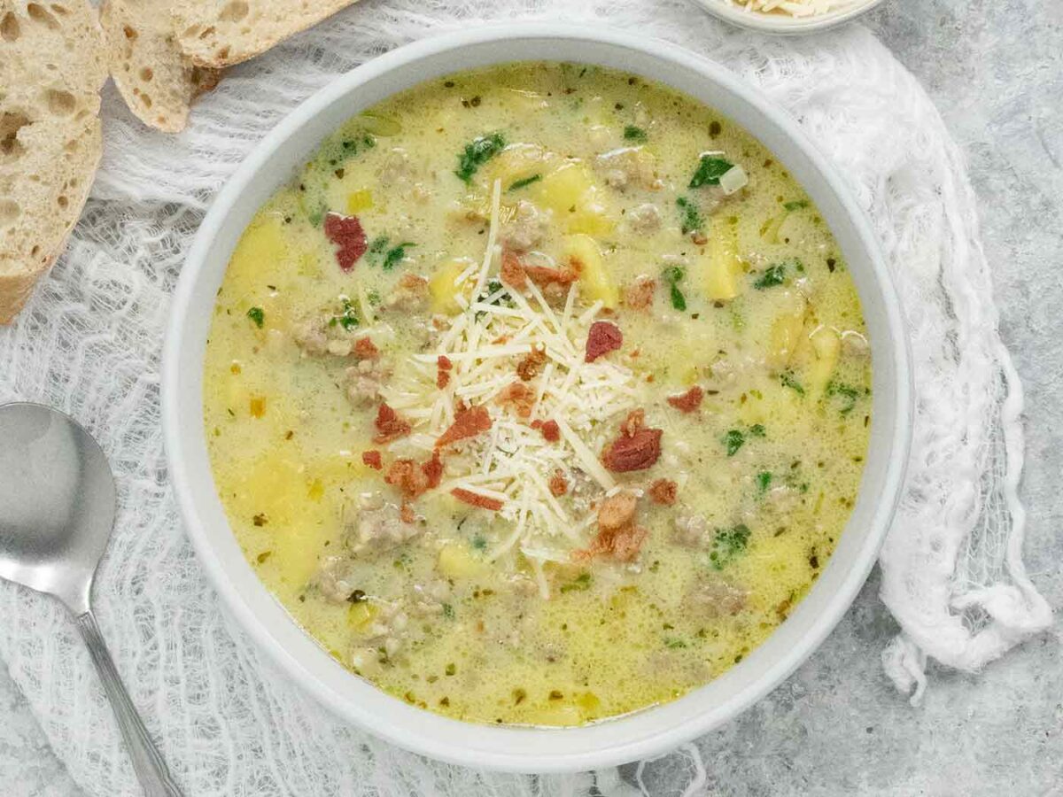 Overhead view of Tuscan Potato Soup in a white bowl.