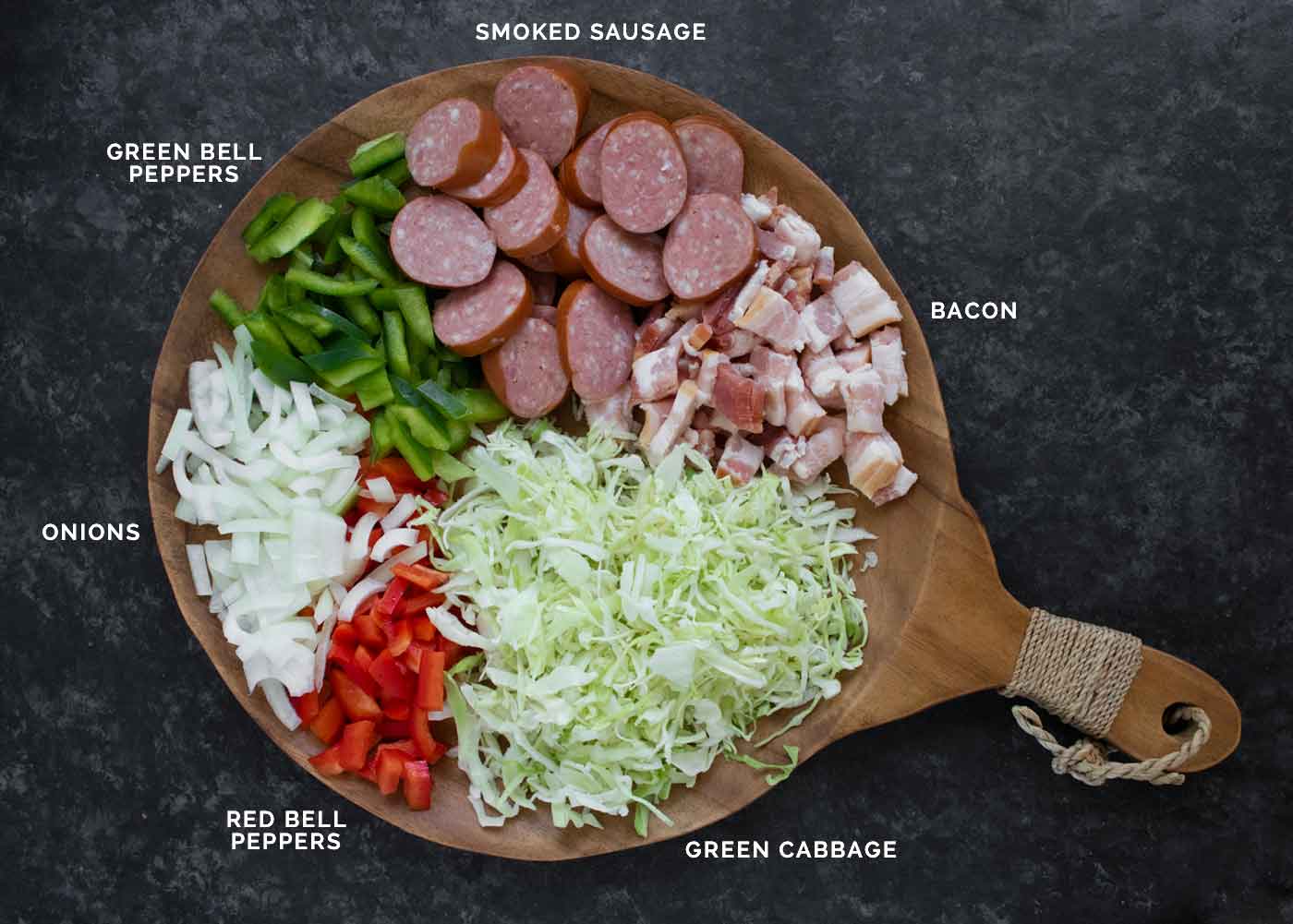 Southern Fried Cabbage ingredients prepped and arranged on a wooden cutting board.