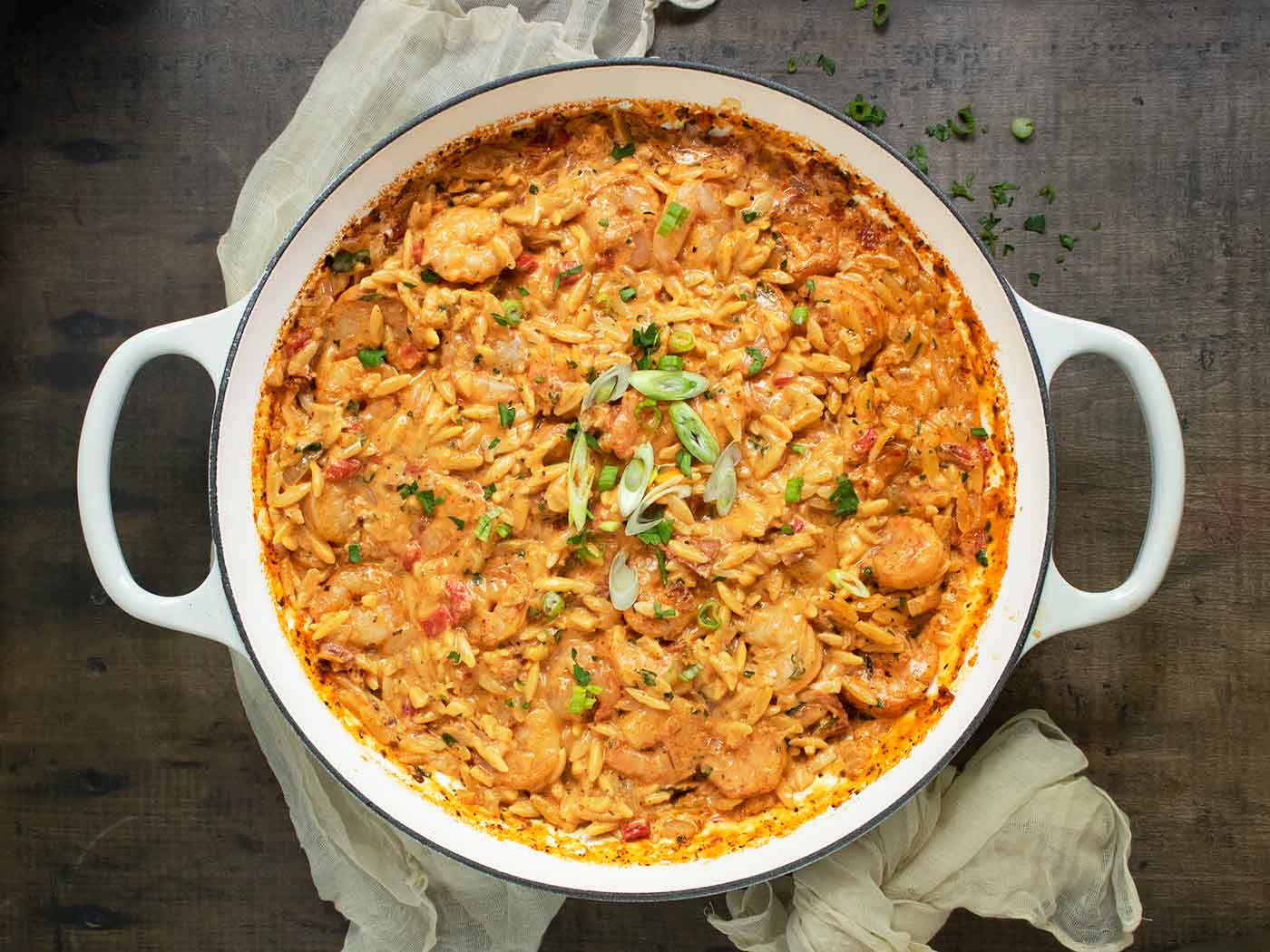 Marry Me Shrimp & Orzo in a large, white enameled skillet.
