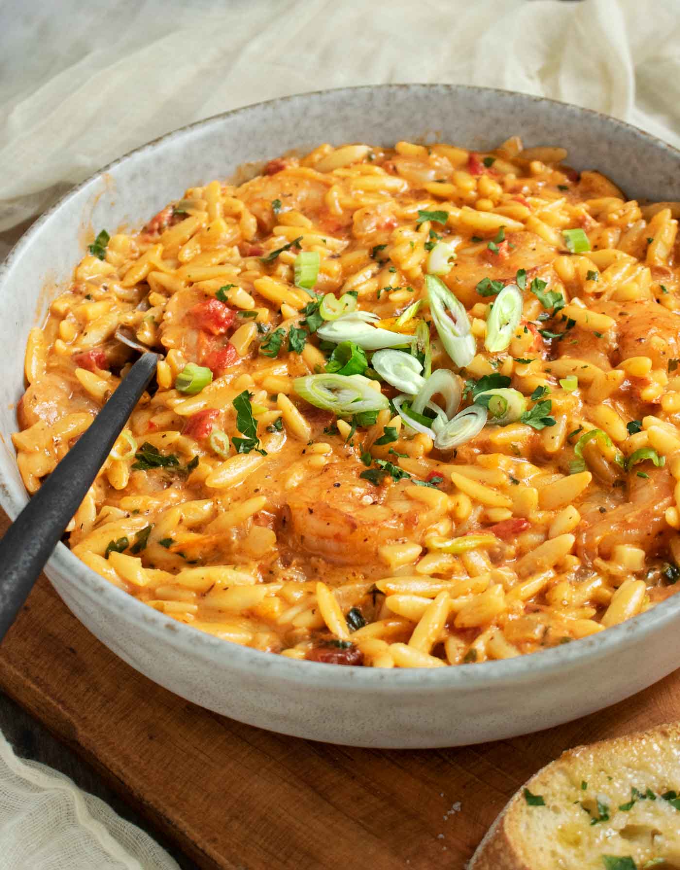 Side-angled view of a bowl of Marry Me Shrimp Orzo.