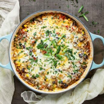 Tex-Mex Beef and Rice in a braiser with light blue handles.