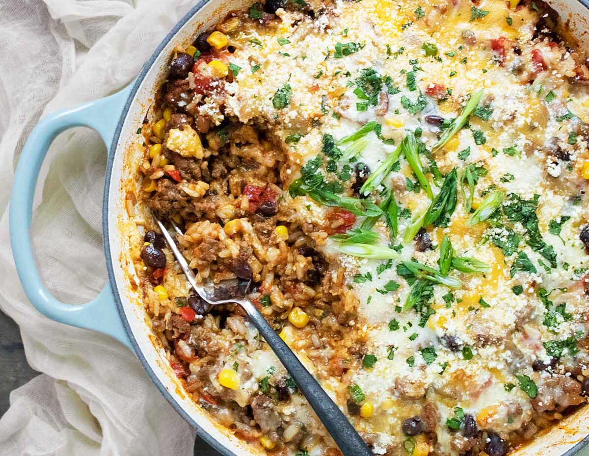 A close-up of the pan with some of the Tex-Mex Beef and Rice taken out of it.