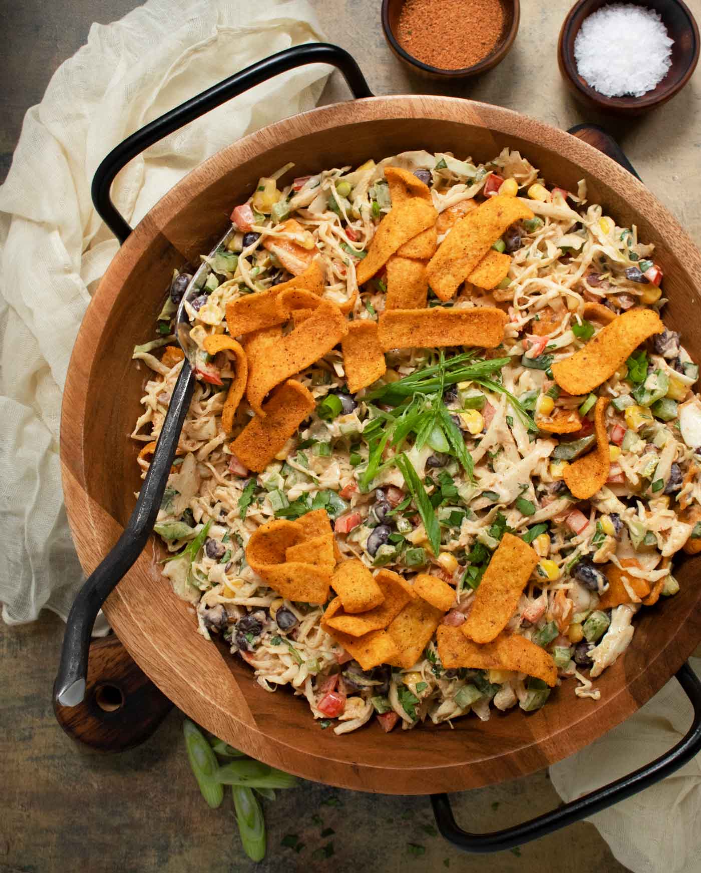 Cowboy Coleslaw in a large serving bowl with Fritos on top.