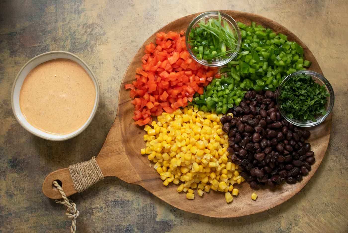 Prepped ingredients arranged on a serving board, ready to add to the slaw.