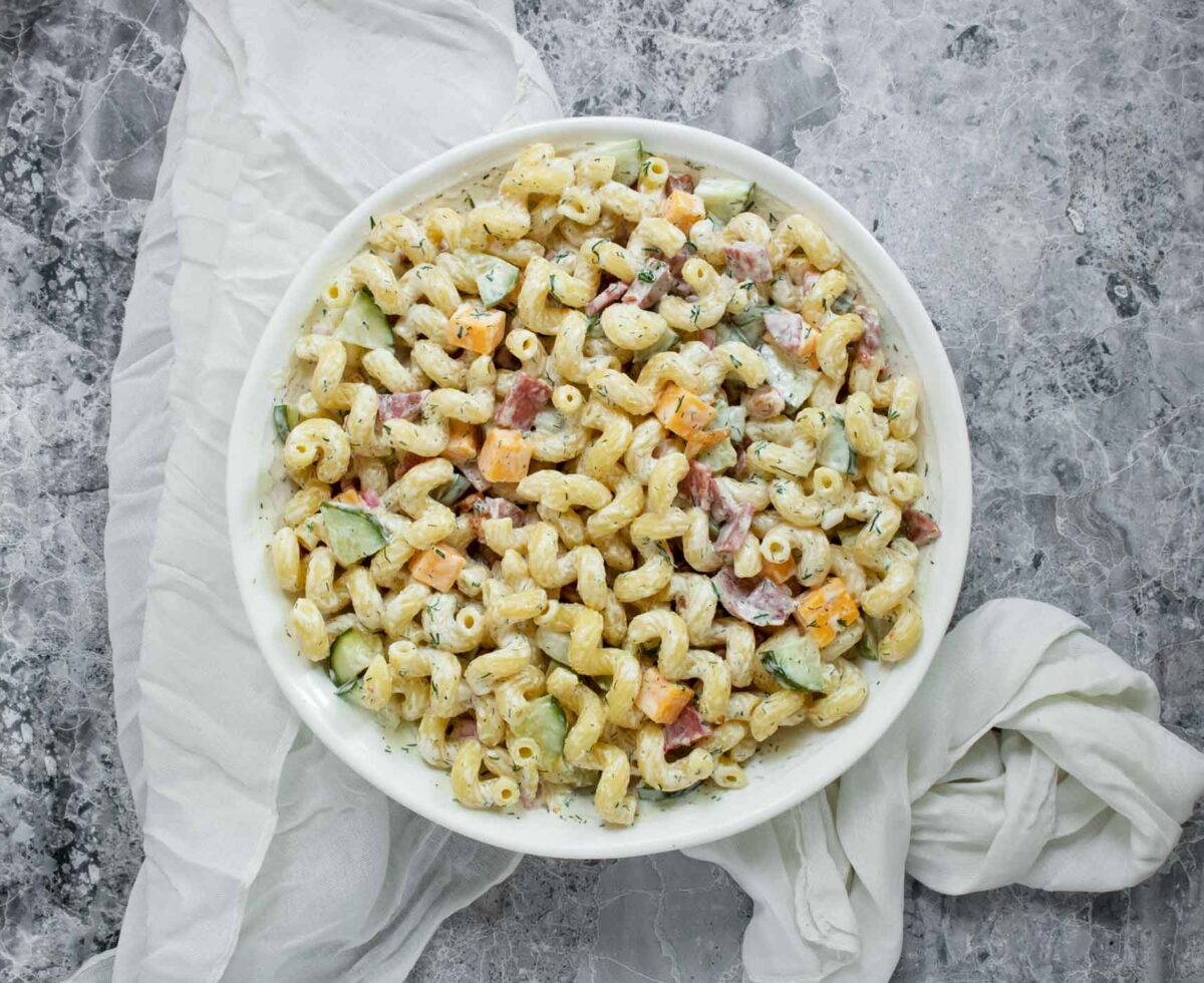 Dill Pickle Pasta Salad in a white serving bowl.