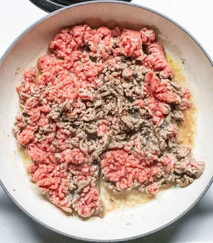 Ground beef browning in a braiser.