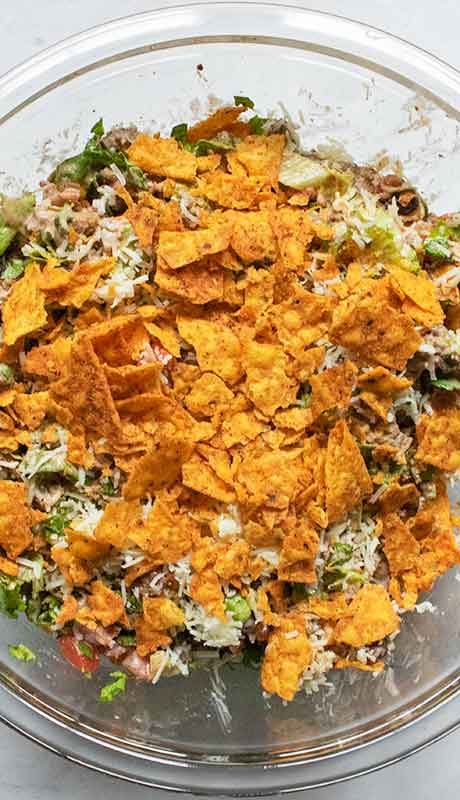 And finally, topping the taco salad with crushed Doritos.