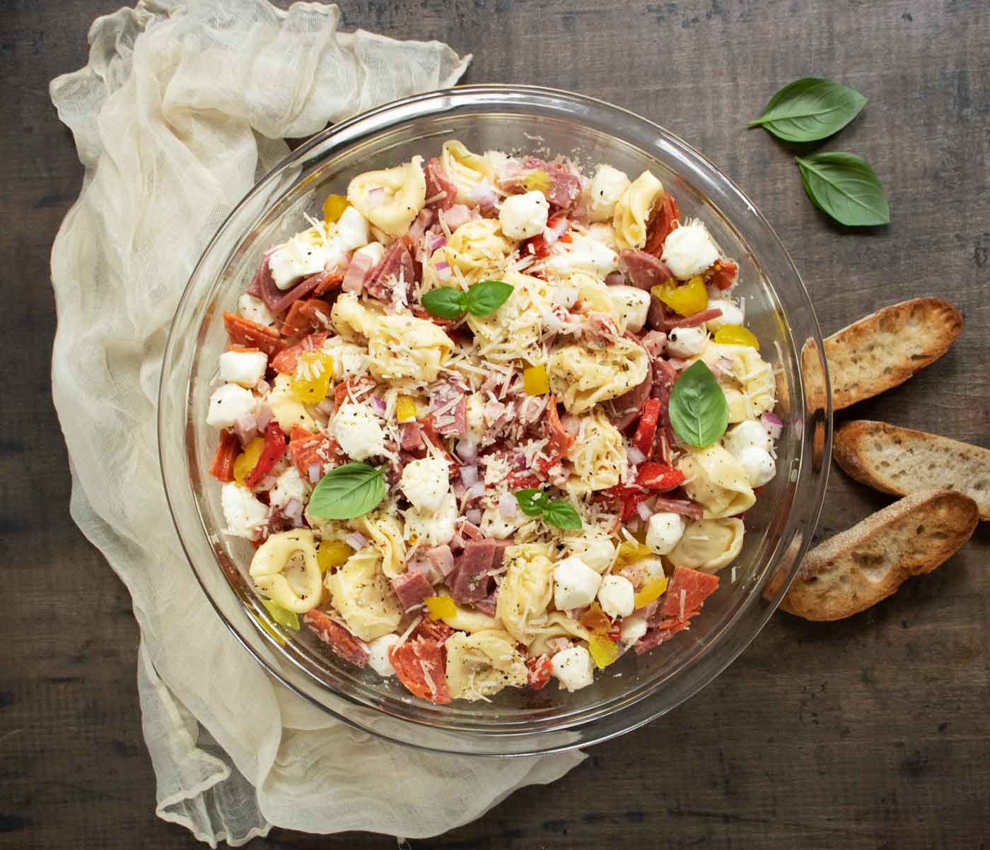 Italian Grinder Tortellini Salad in a large glass serving bowl.