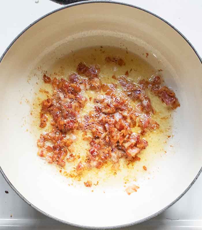 Bacon crisped up and ready to transfer to a plate.