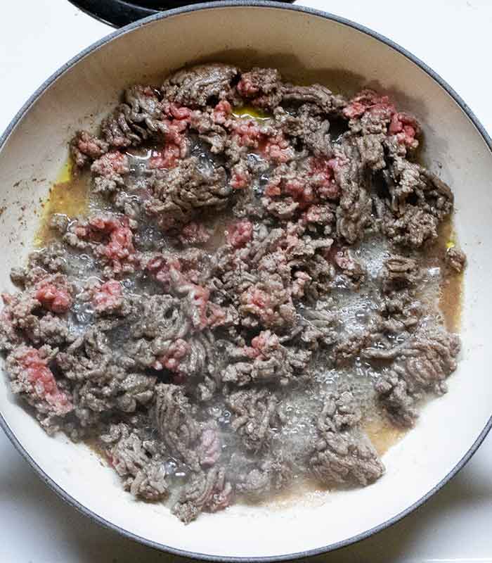 The ground beef mostly browned.