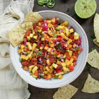 Overhead view of a bowl of Peach Salsa.