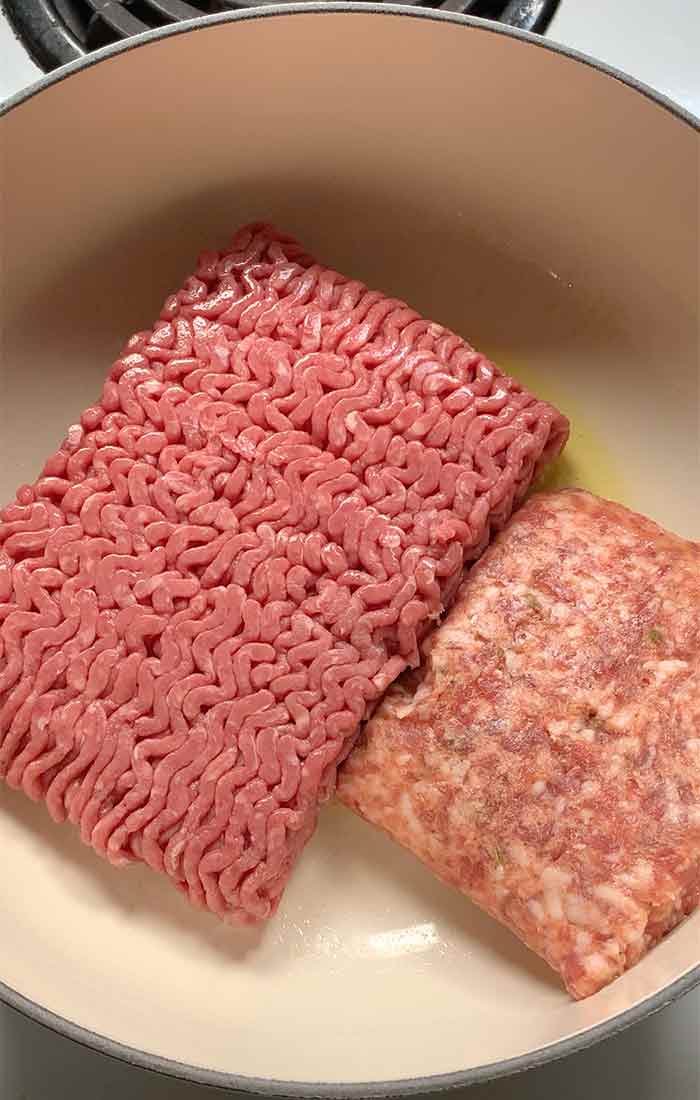 Ground beef and Italian sausage in the pot.
