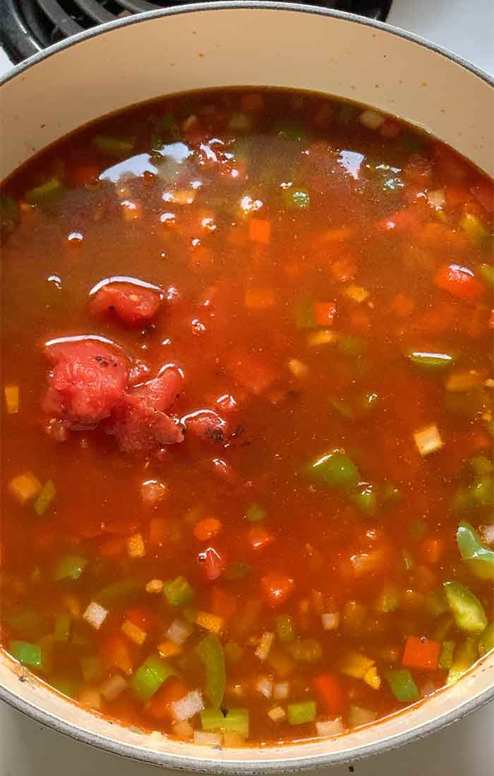 Broth and tomato products in the pot. Let's cook some soup!
