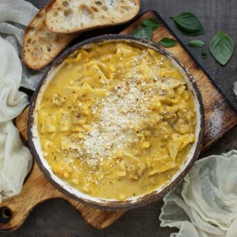 Butternut Squash Lasagna Soup in a bowl on a serving board.