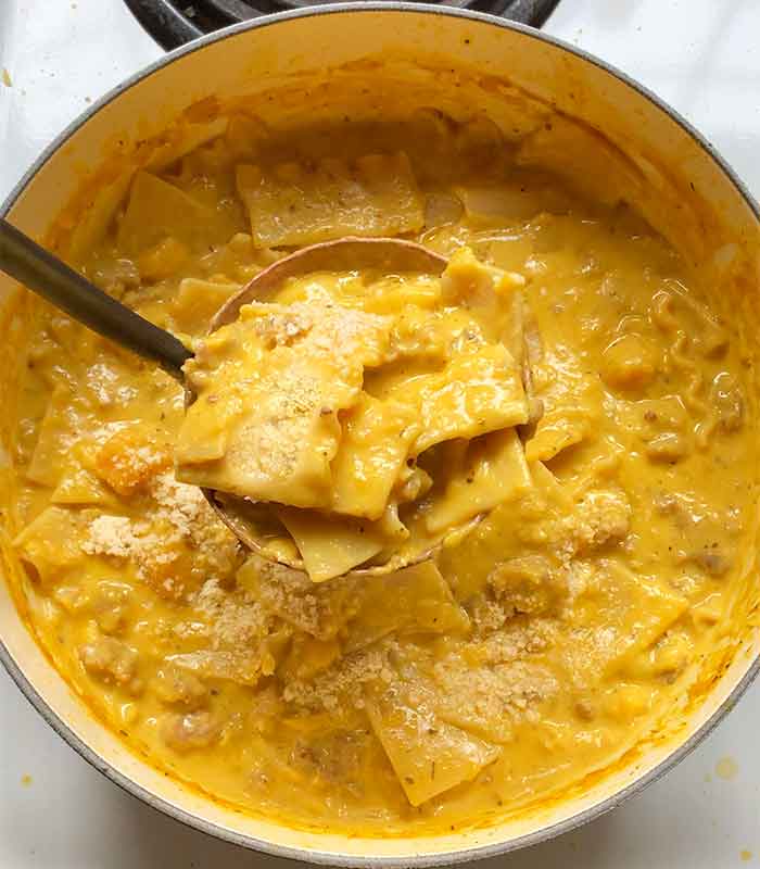 Adding a generous dusting of grated parmesan cheese, and ready to serve.