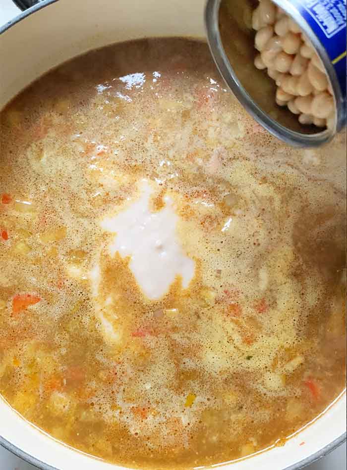 The remaining white beans go into the soup.