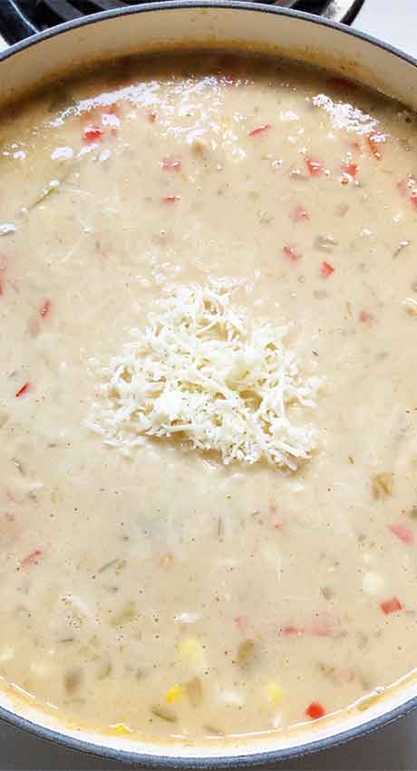 Mixing in the cheese until melted and incorporated.