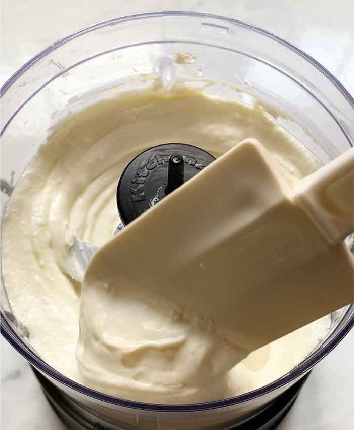 Whipped ricotta in the food processor bowl, ready to go.