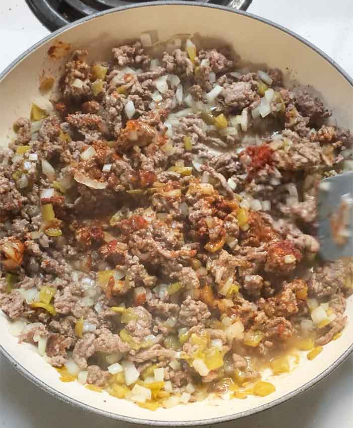 Said spurtle mixing the beautifully scented spices into the beef, onions, and green chiles (don't worry, I can't smell them either).
